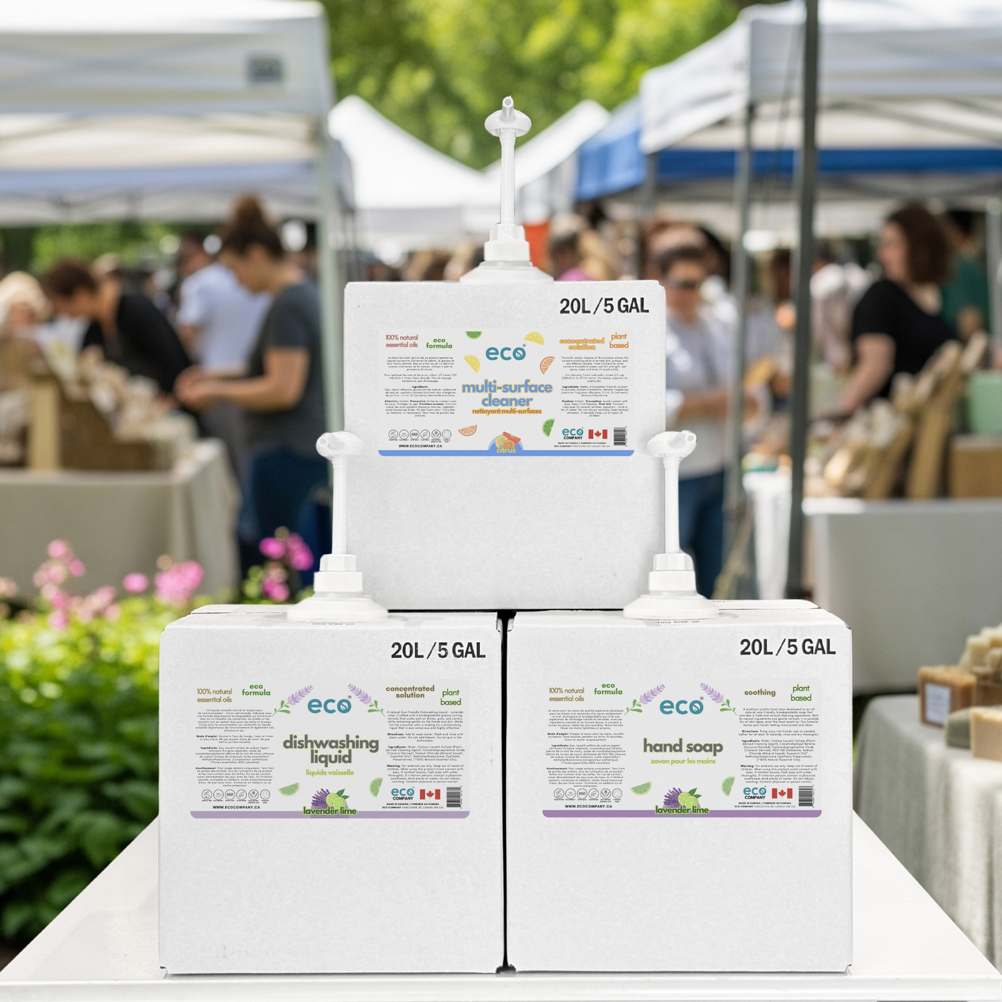 Refill station with refill boxes of bulk dish soap, hand soap, and multi-surface cleaner at farmer's market pop-up event.