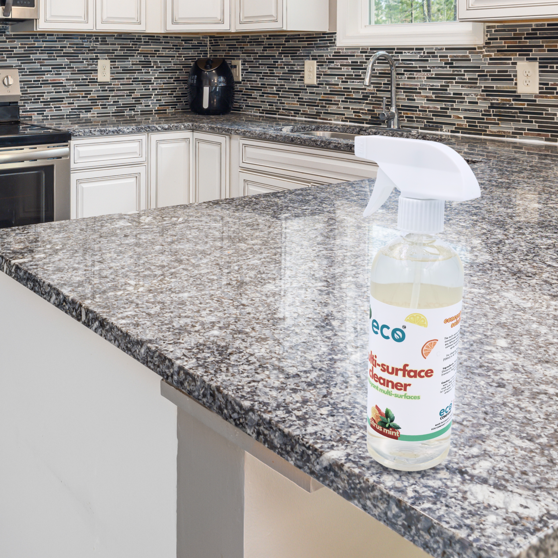 Eco Company's multi-surface cleaner on the kitchen counter, for an eco-friendly cleaning routine. 