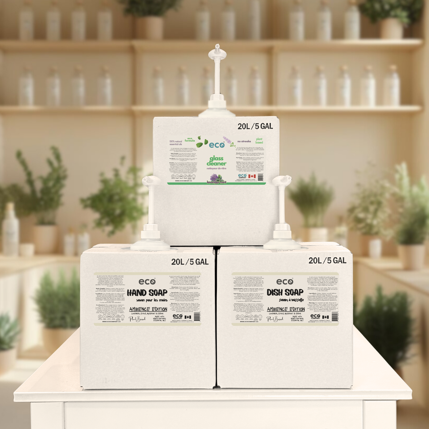 Refill station of refill boxes containing eco glass cleaner, hand soap, and dish soap at a refill store.