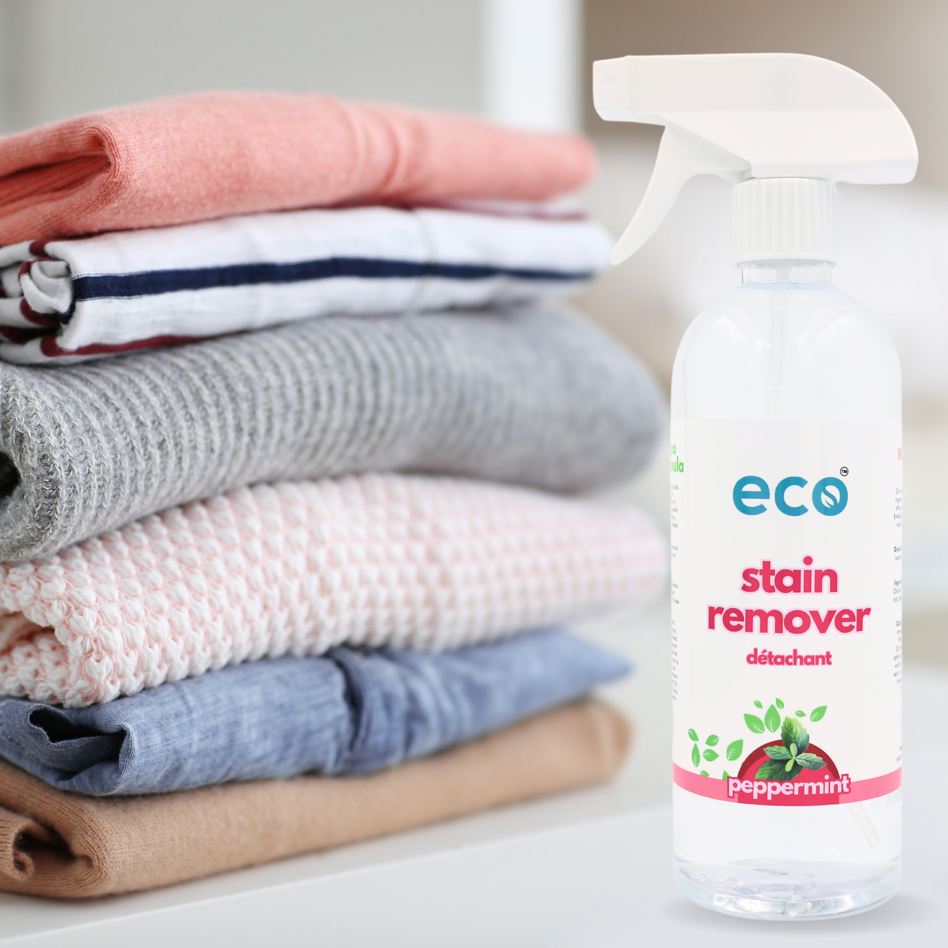 A bottle of eco fabric stain remover in peppermint, for a plant-based and eco-friendly laundry routine.