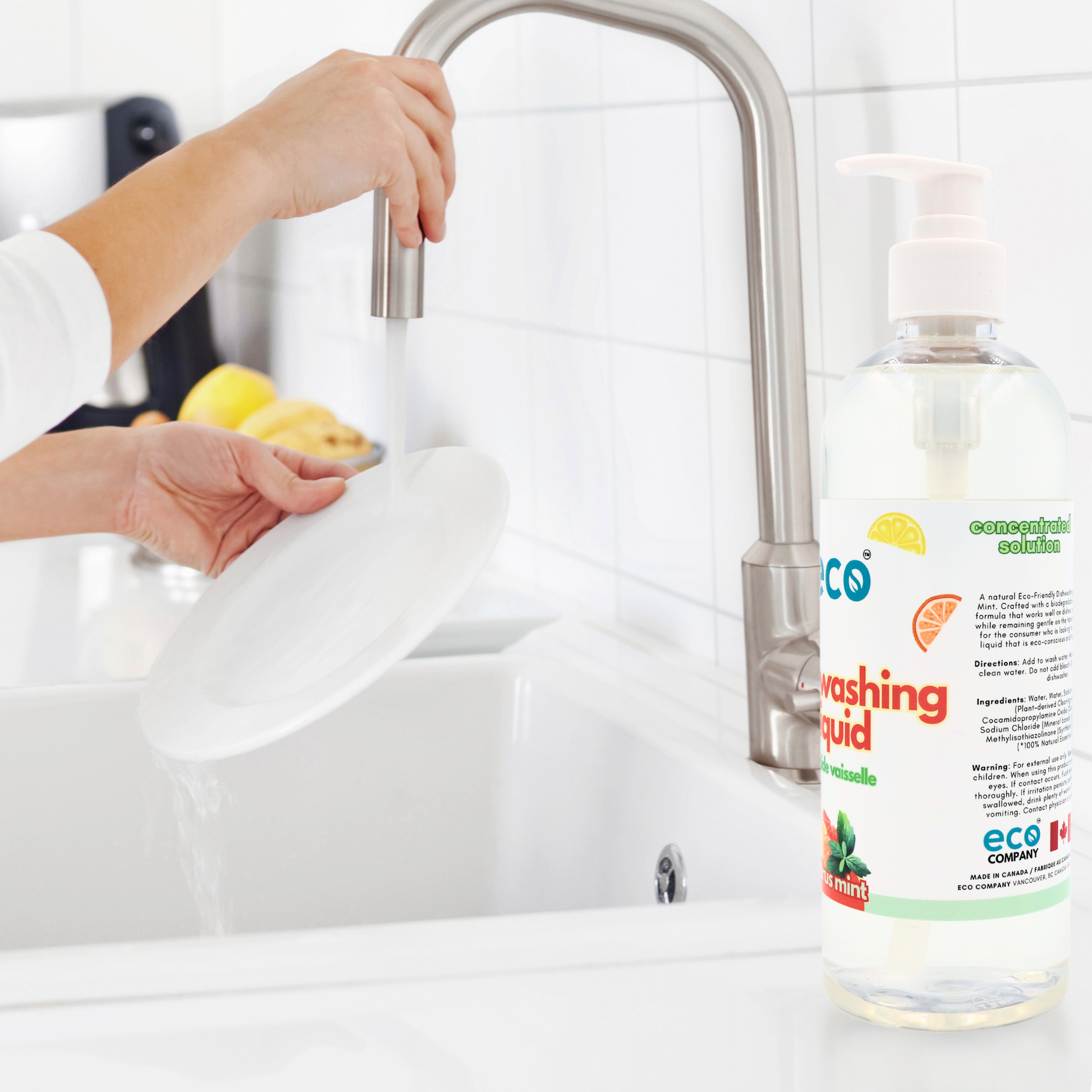 Person washing dishes with plant-based dish soap, for eco-friendly cleaning.