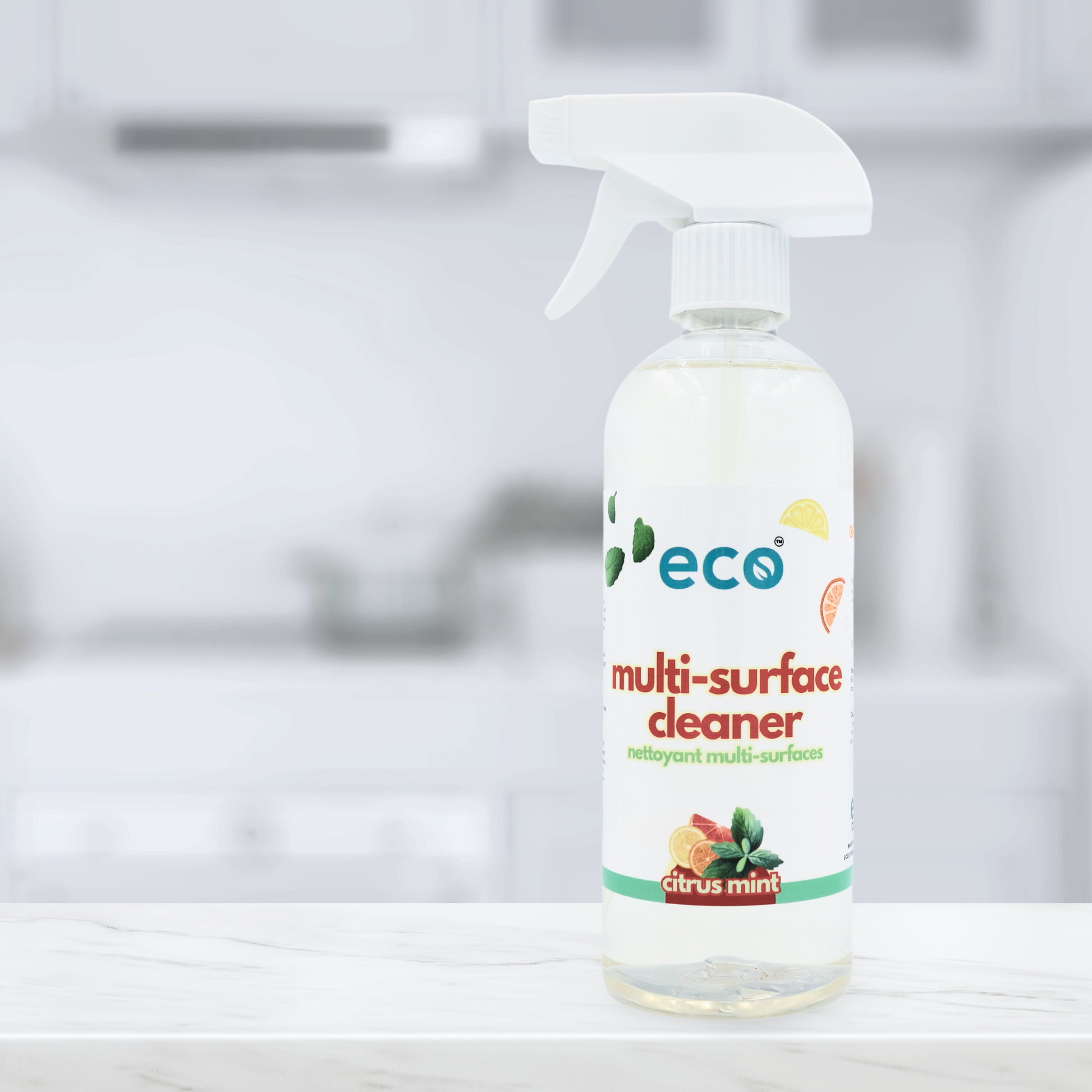 Eco Company's multi-surface cleaner on a kitchen counter, for eco-friendly home cleaning.