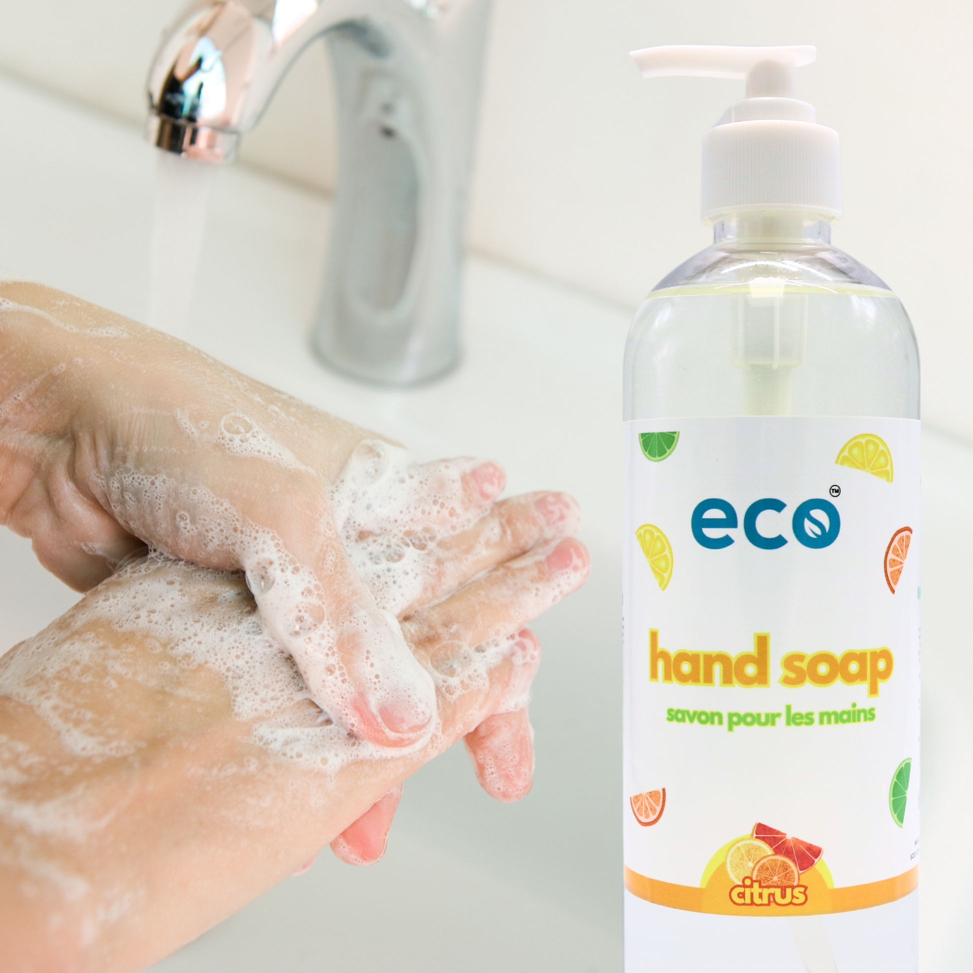 Individual using citrus-scented eco soap to wash their hands, promoting eco-friendly living.