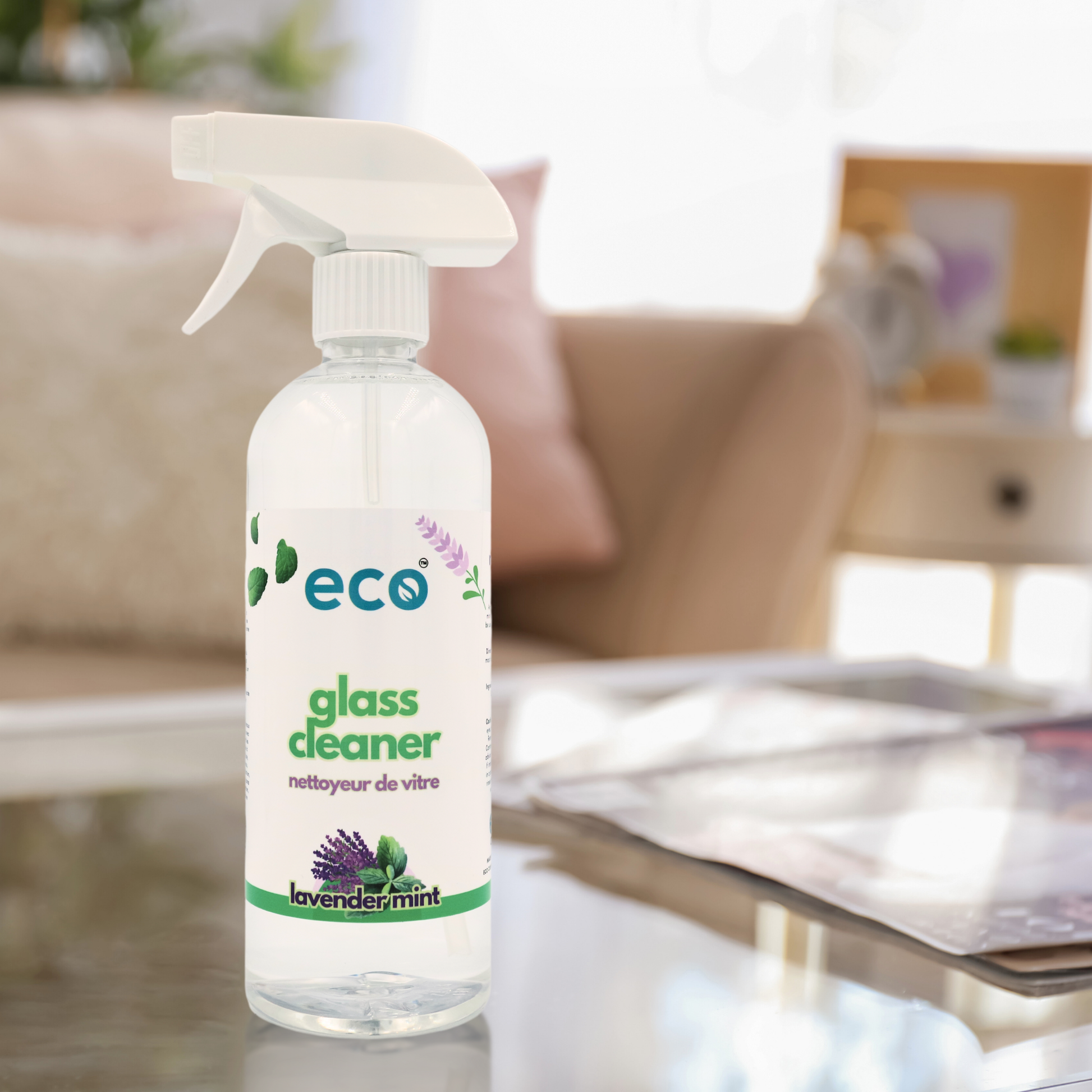 Eco-friendly glass cleaner bottle on a shiny clean table.